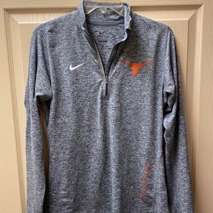 Gray and white Nike three quarter zip pull over.